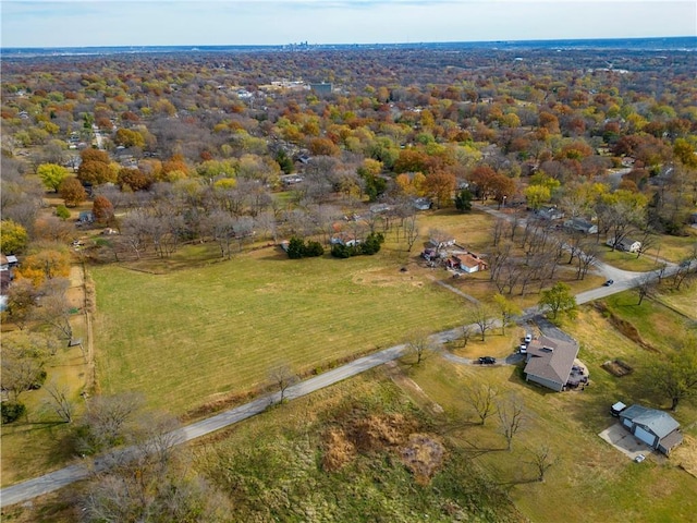 birds eye view of property with a rural view