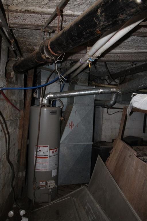 utility room featuring water heater