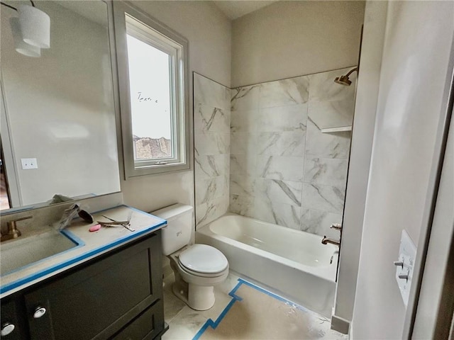 full bathroom with vanity, toilet, and tiled shower / bath