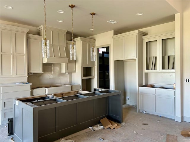 kitchen with a center island and hanging light fixtures