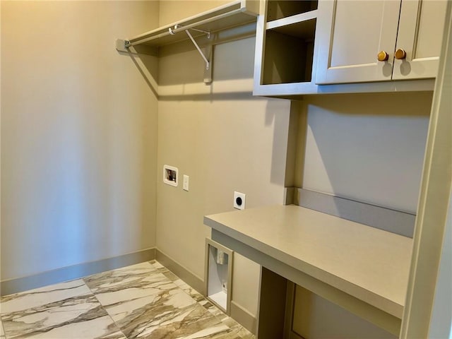 laundry area featuring washer hookup, marble finish floor, cabinet space, electric dryer hookup, and baseboards