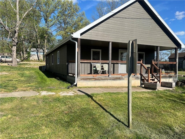 bungalow-style home with a porch and a front yard