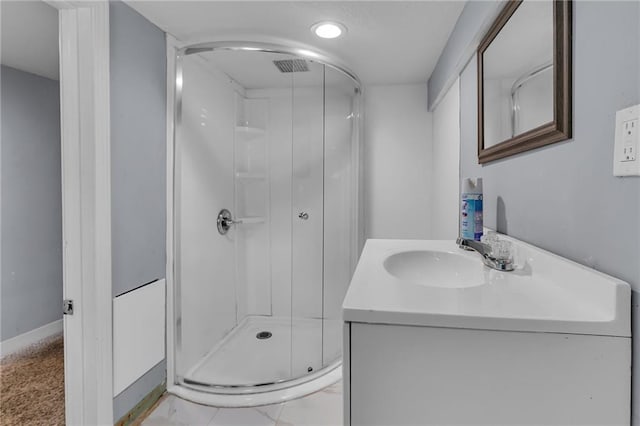 bathroom featuring vanity and a shower with shower door