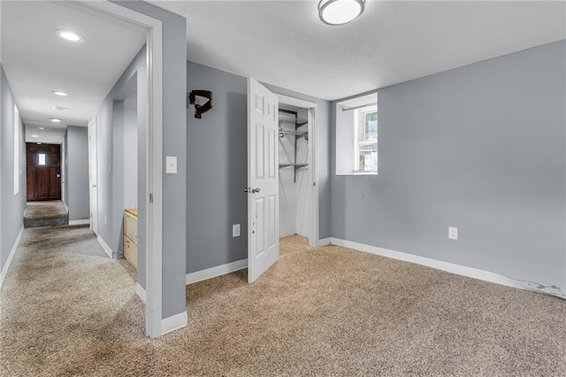 unfurnished bedroom with carpet and a closet