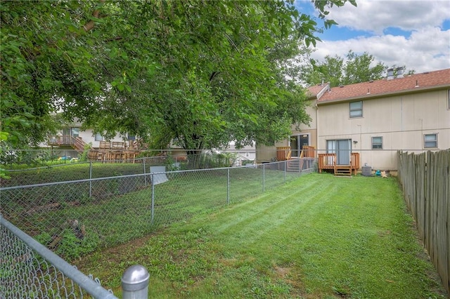 view of yard featuring a wooden deck