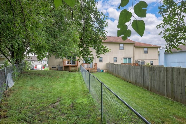 view of yard featuring a wooden deck