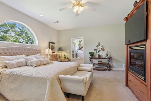 carpeted bedroom with ceiling fan