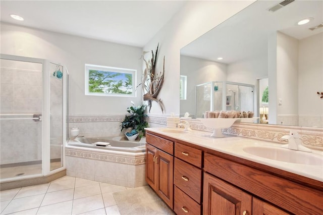 bathroom featuring tile patterned flooring, vanity, and independent shower and bath