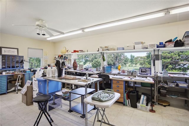 interior space with a workshop area, plenty of natural light, and ceiling fan