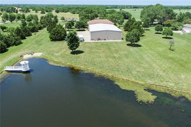 birds eye view of property featuring a water view and a rural view