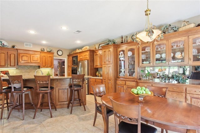 dining area featuring light tile patterned flooring, visible vents, and recessed lighting