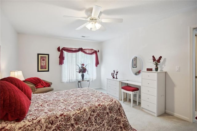 bedroom with a ceiling fan, visible vents, light carpet, and baseboards