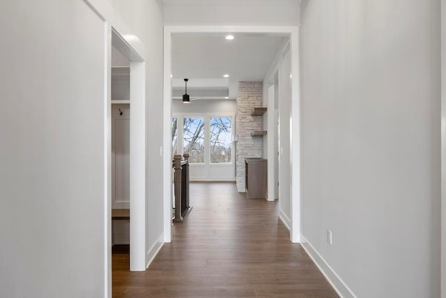 corridor featuring dark hardwood / wood-style flooring