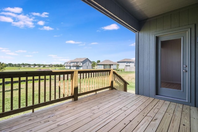 wooden deck with a yard