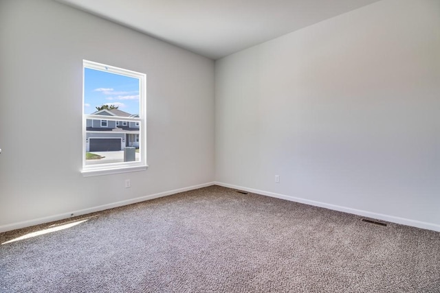 spare room featuring carpet