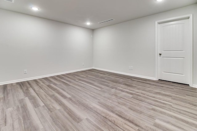 spare room with light hardwood / wood-style floors