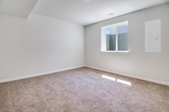 unfurnished room featuring carpet floors and electric panel