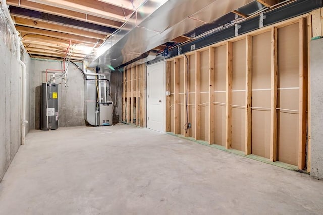 basement featuring heating unit and water heater