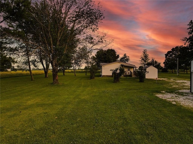 view of yard at dusk