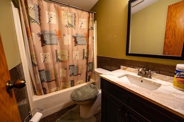 full bathroom with shower / bath combo with shower curtain, toilet, and vanity