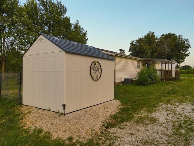 view of outbuilding featuring a yard