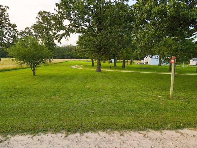 view of home's community featuring a yard