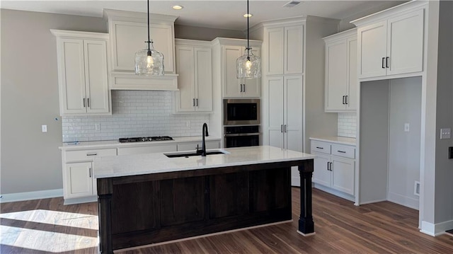 kitchen featuring dark wood finished floors, white cabinetry, a sink, and black appliances