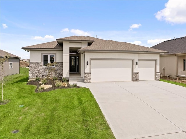 prairie-style house with a garage and a front yard