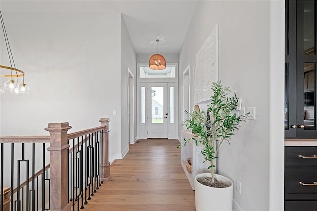 foyer with light hardwood / wood-style floors