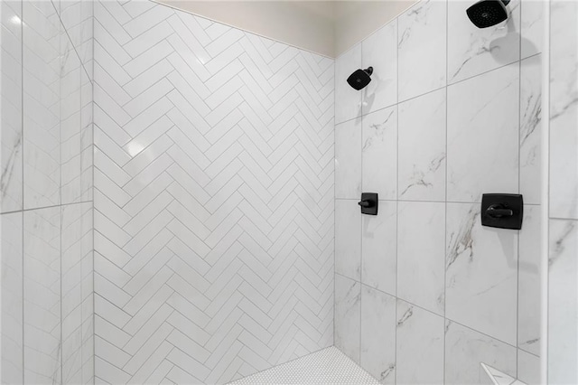 bathroom with tiled shower