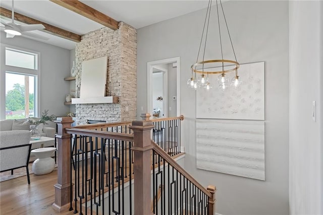 interior space with hardwood / wood-style flooring and beam ceiling