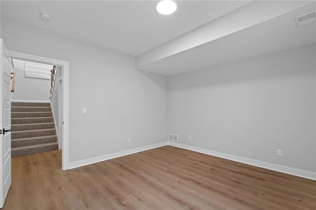 spare room with light hardwood / wood-style flooring