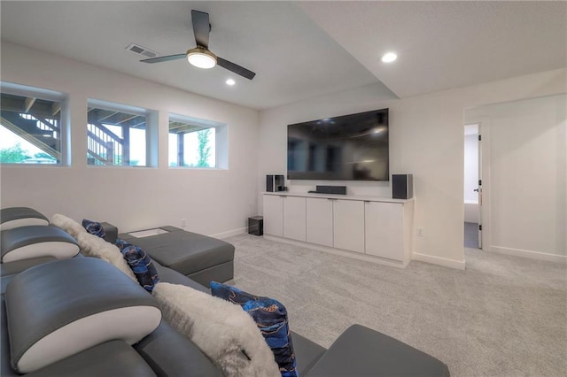 living room with light carpet and ceiling fan