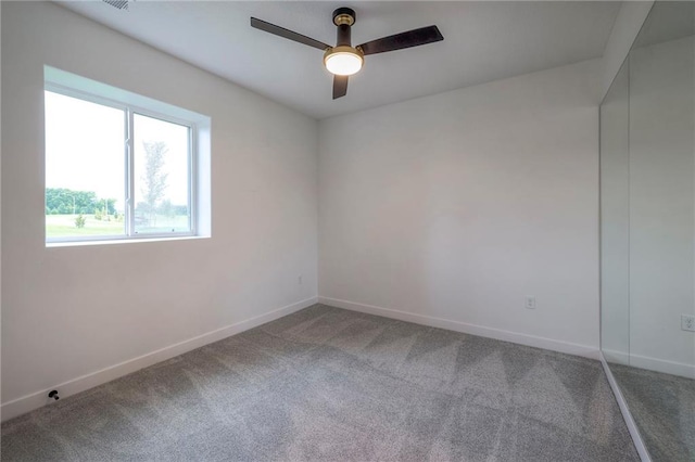 unfurnished room featuring carpet flooring and ceiling fan