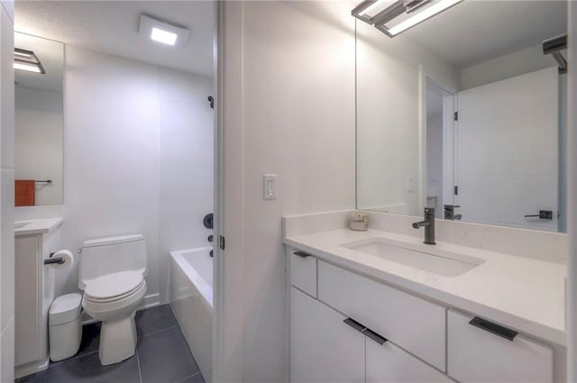 full bathroom with tile patterned flooring, vanity, shower / washtub combination, and toilet