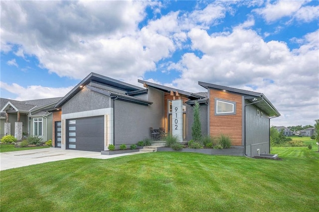 modern home with a garage and a front yard