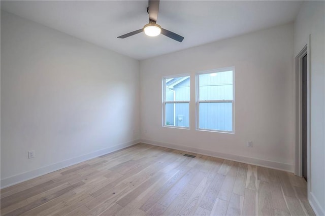 unfurnished room with light hardwood / wood-style flooring and ceiling fan