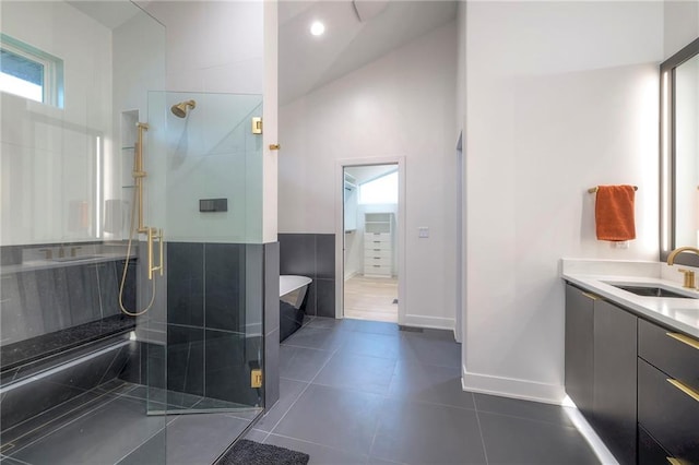 bathroom with vanity, tile patterned floors, and a shower with shower door