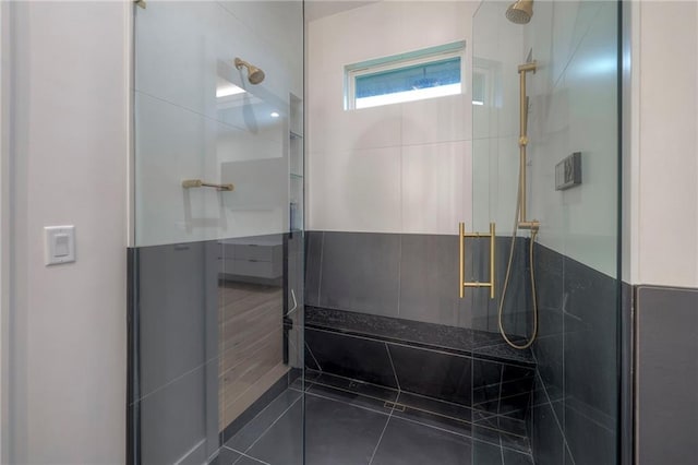 bathroom with a shower with shower door