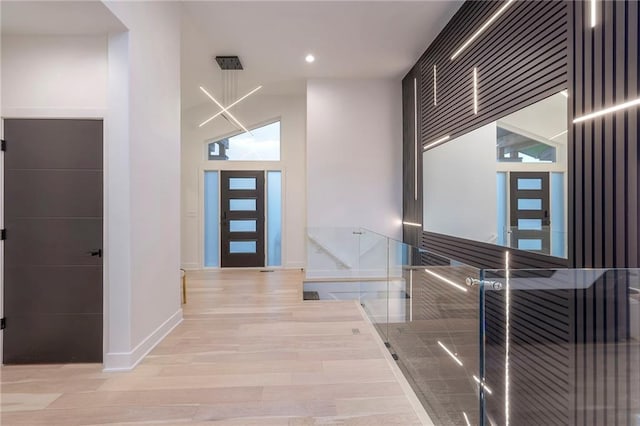 hall with light hardwood / wood-style floors