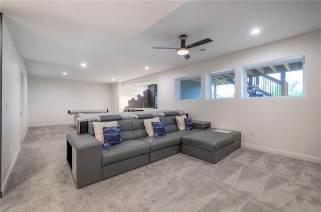 cinema with light colored carpet and ceiling fan