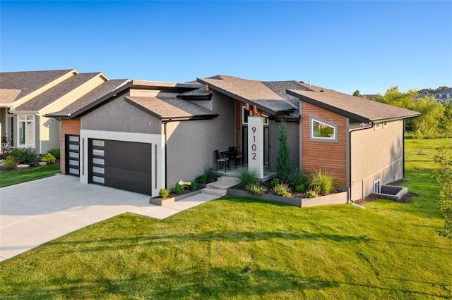 view of front of house with a garage and a front lawn