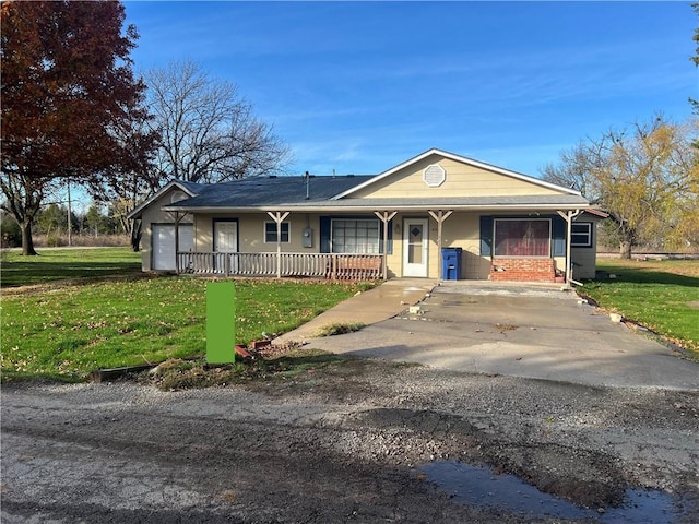 ranch-style home with a garage and a front yard