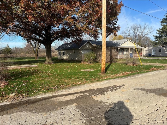 view of front of house with a front yard and a porch