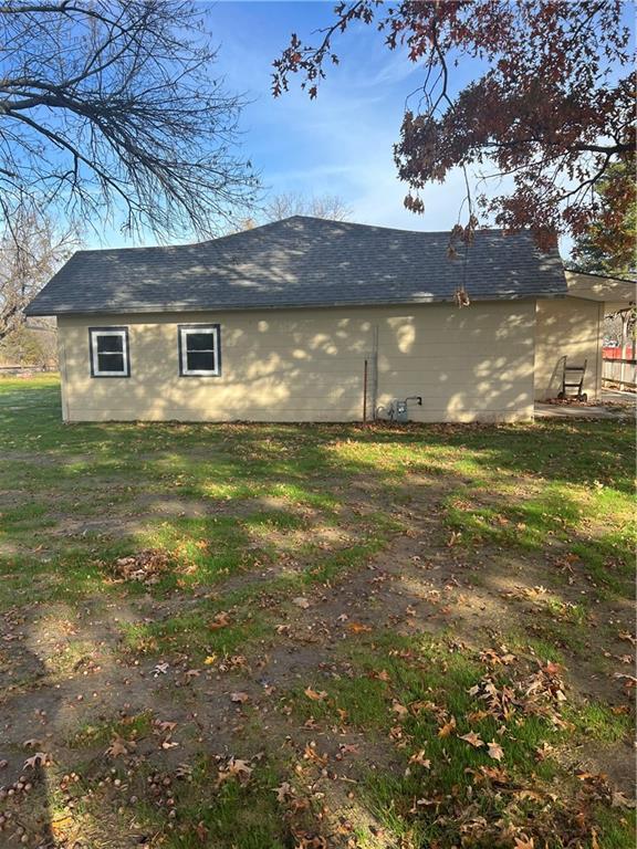 view of home's exterior with a lawn