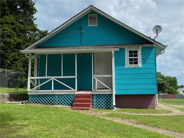 bungalow with a front yard