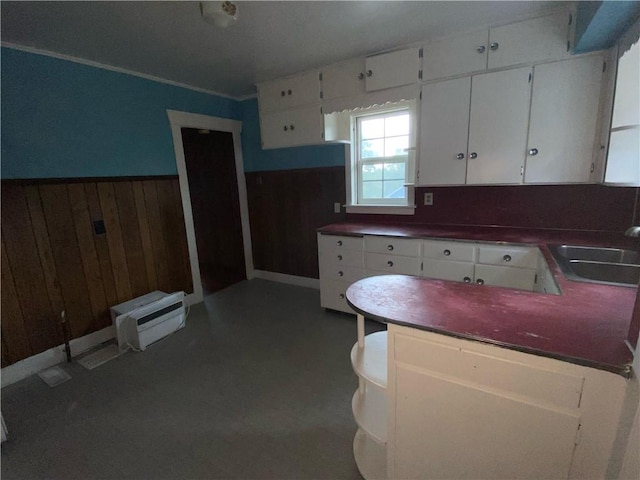 kitchen featuring sink and white cabinets