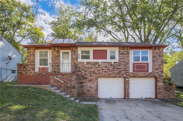 view of front of house with a front lawn and a garage