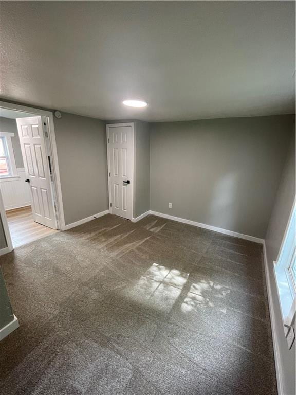 unfurnished bedroom with carpet