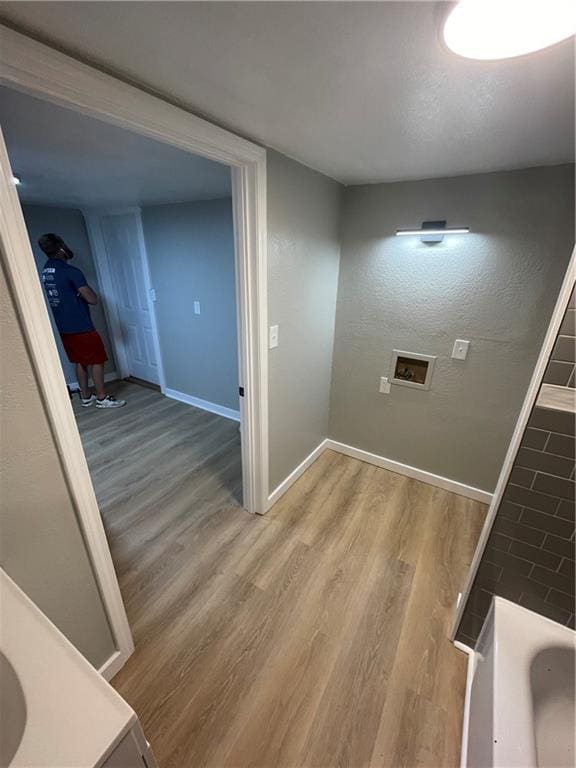 hallway with wood-type flooring